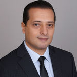 Headshot of Happy Basla, real estate agent