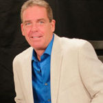 Headshot of Greg Gray, real estate agent