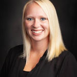 Headshot of Aubrey Thomas, real estate agent