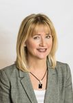 Headshot of Elena Omirova Davidson, real estate agent
