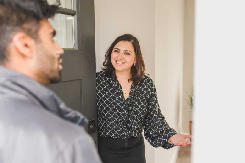 Agent greeting an interested buyer