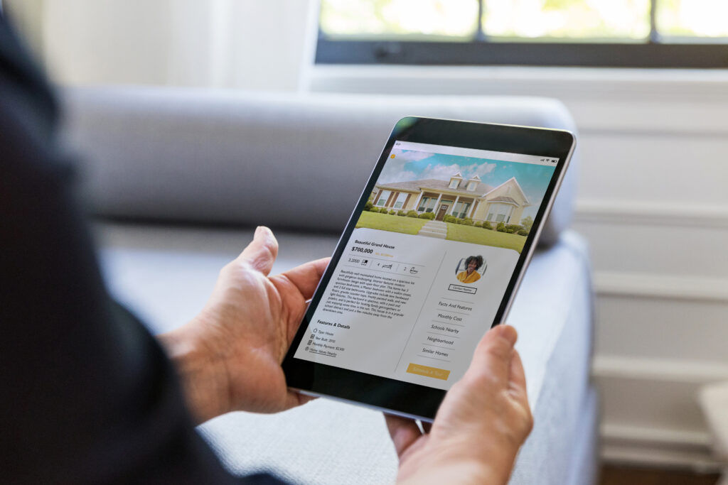 searching for homes and housing market trends on an ipad