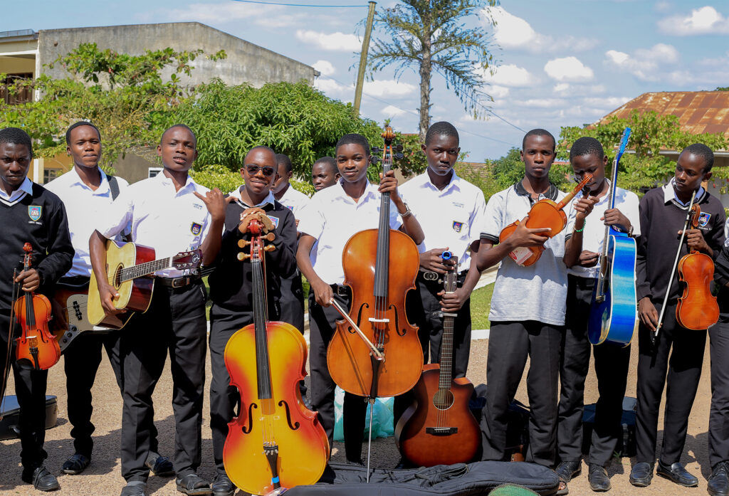 kids with refurbished string instruments
